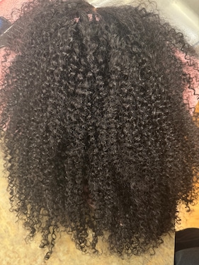 I love this kinky curly wig.. When I washed it it was light shedding no smell to it. The band makes it secure in your head. This can be glueless.