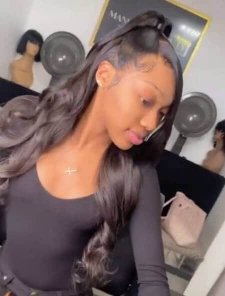 half up half down body wave style with swoops
