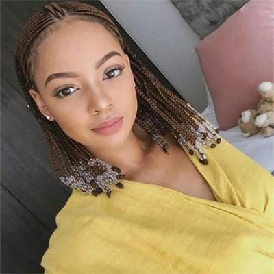 Light brown small knotless braids with beads