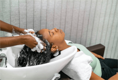 a-woman-washing-her-hair-in-hairdressers
