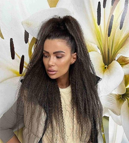 long crimped hairstyle with a high half pony