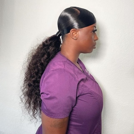 swoop ponytail with curly hair